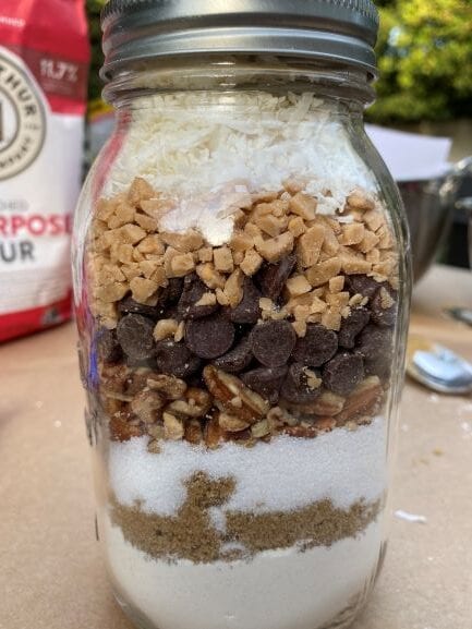 A cookie jar filled with cookie ingredients