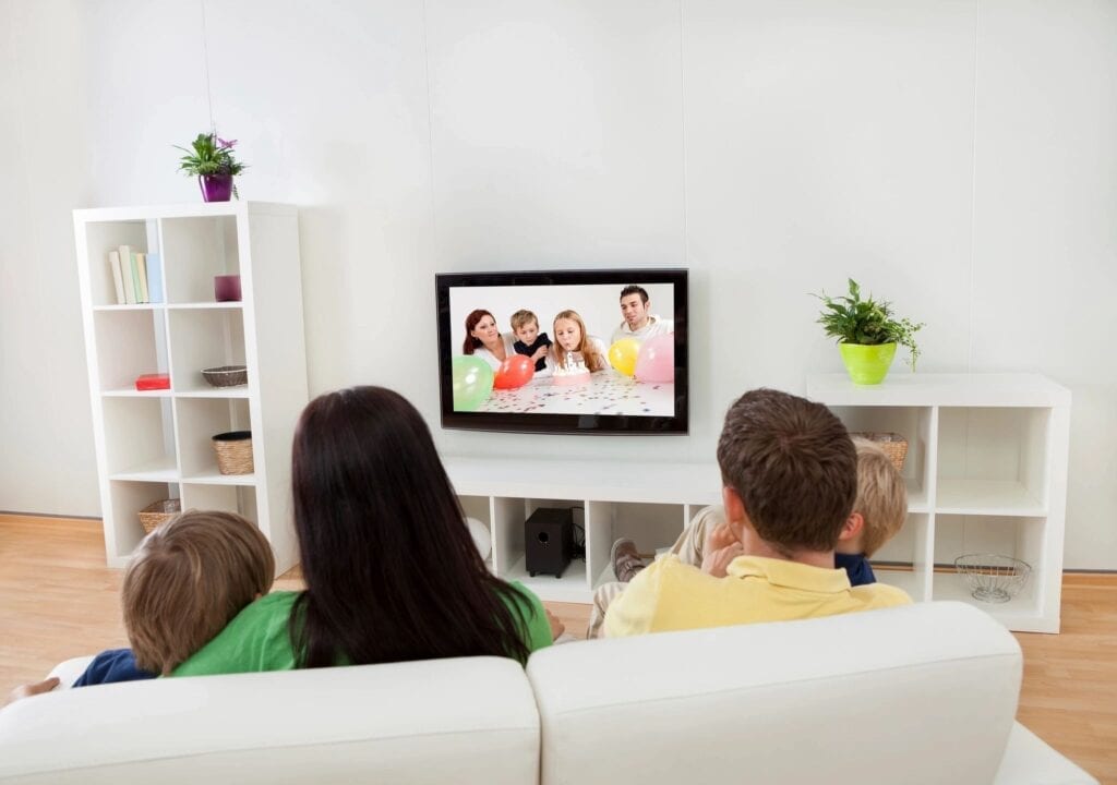 family watching television together